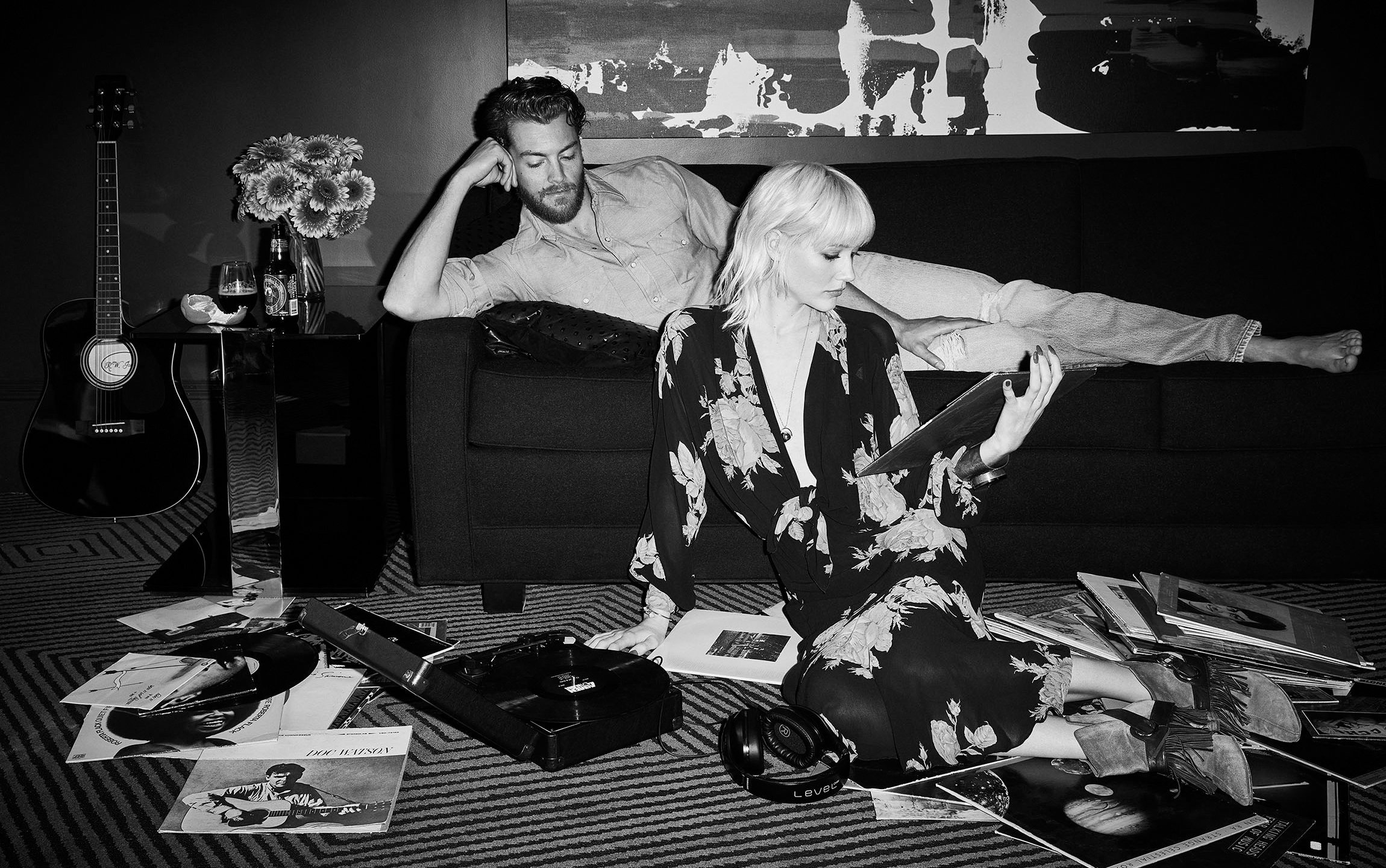 A couple looking at records in their Zeppelin Hotel suite